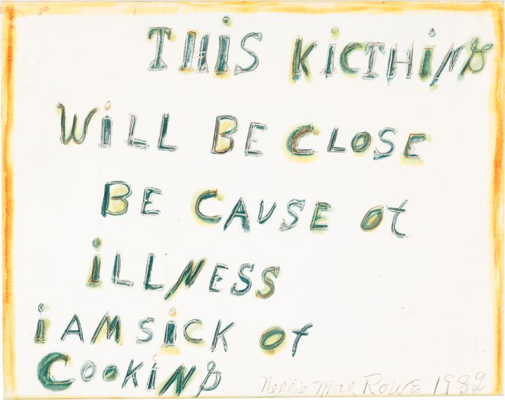 Text that reads, “This Kitchen Will Be Close Be Cause of illness I Am Sick of Cooking” is written with green and brown crayon on white paper with orange edges.